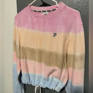 Tie dye PINK sweater with tie at the bottom.